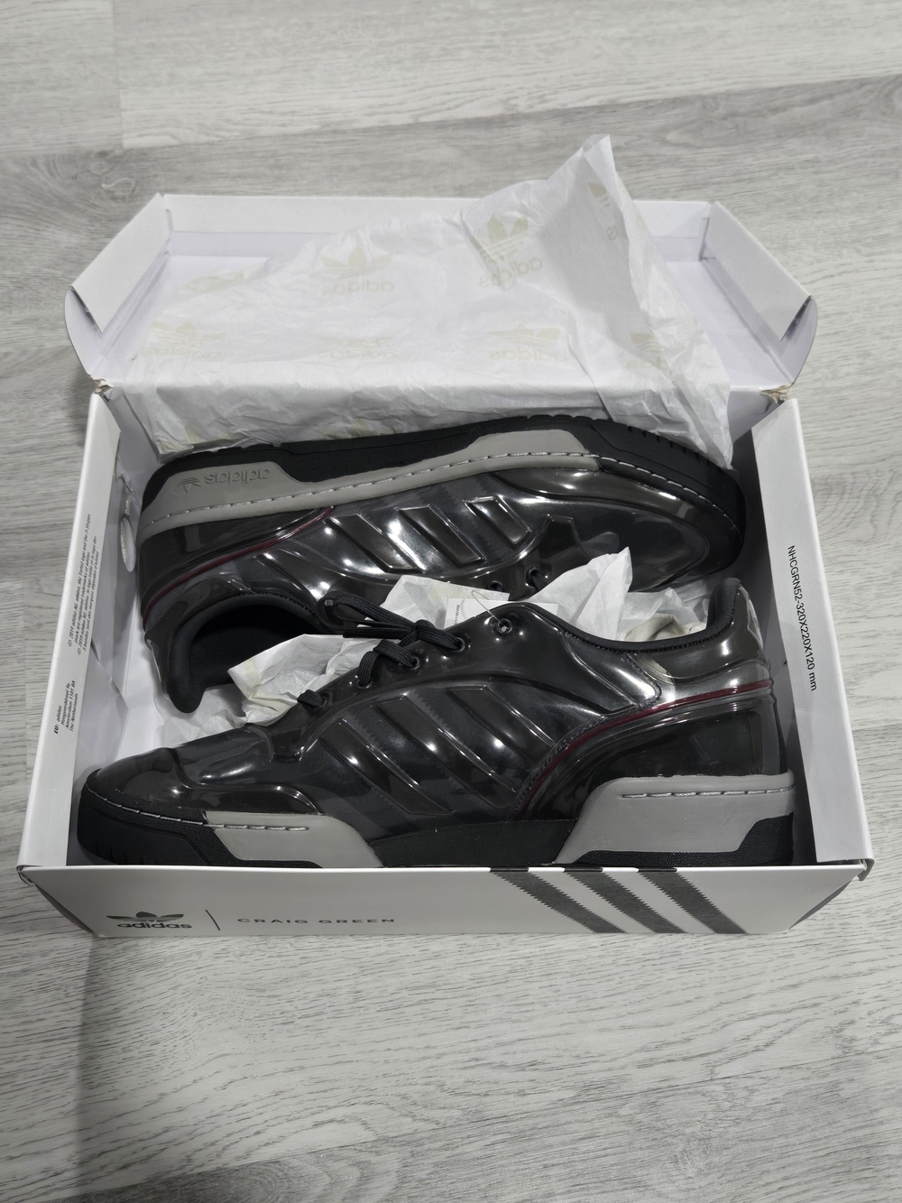 adidas Men’s Glossy Black Athletic Sneakers with Gray Accents and Red Stripe